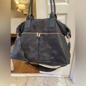 A new day nylon black weekender bag with crossbody strap/gold hardware